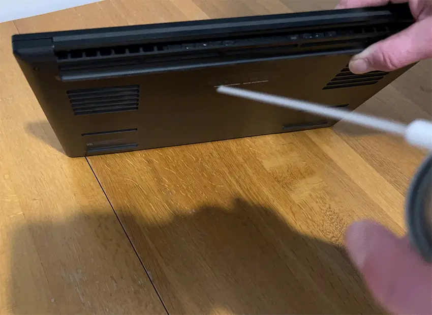 Spraying Compressed Air through the vents of a Razer Laptop